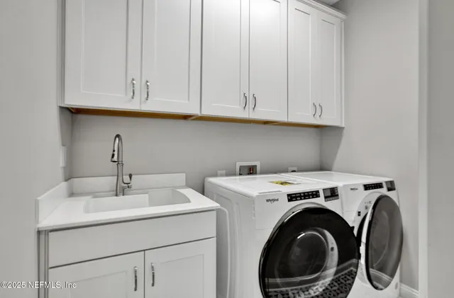 a utility room with dryer and washer
