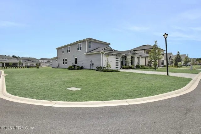 a view of a house with a big yard