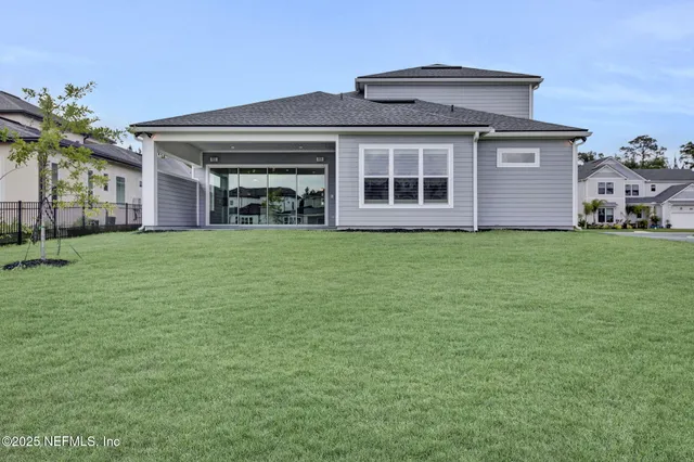 a view of a lake with houses in the background