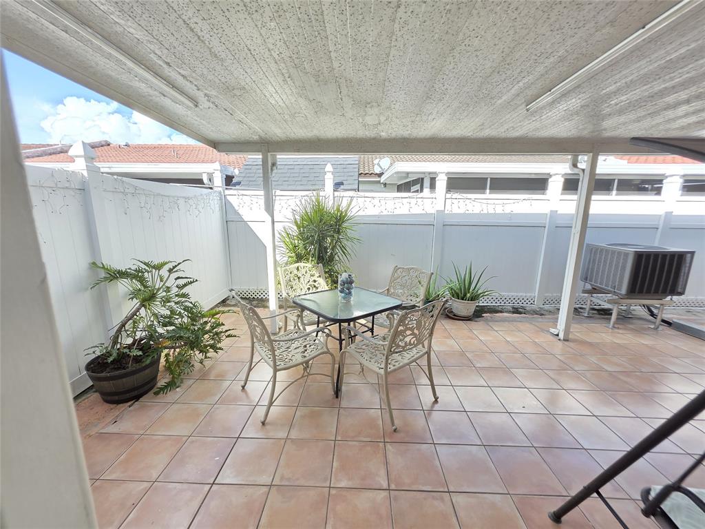7635 Northwest 181st Street Hialeah, FL 33015 - Photo 12 of 12 a outdoor dining space with furniture