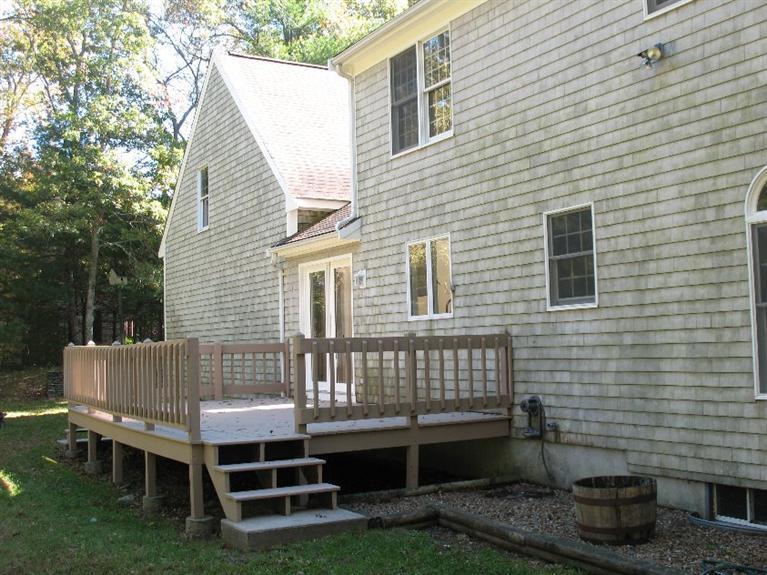 6 Yearling Run Road Buzzards Bay, MA 02532 - Photo 29 of 34 a view of backyard with deck and seating space