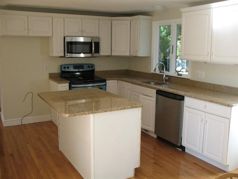 6 Yearling Run Road Buzzards Bay, MA 02532 - Photo 4 of 34 a kitchen with a sink a stove and cabinets