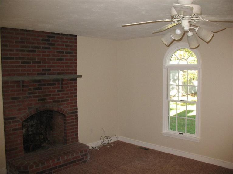 6 Yearling Run Road Buzzards Bay, MA 02532 - Photo 6 of 34 an empty room with windows mirror and fireplace