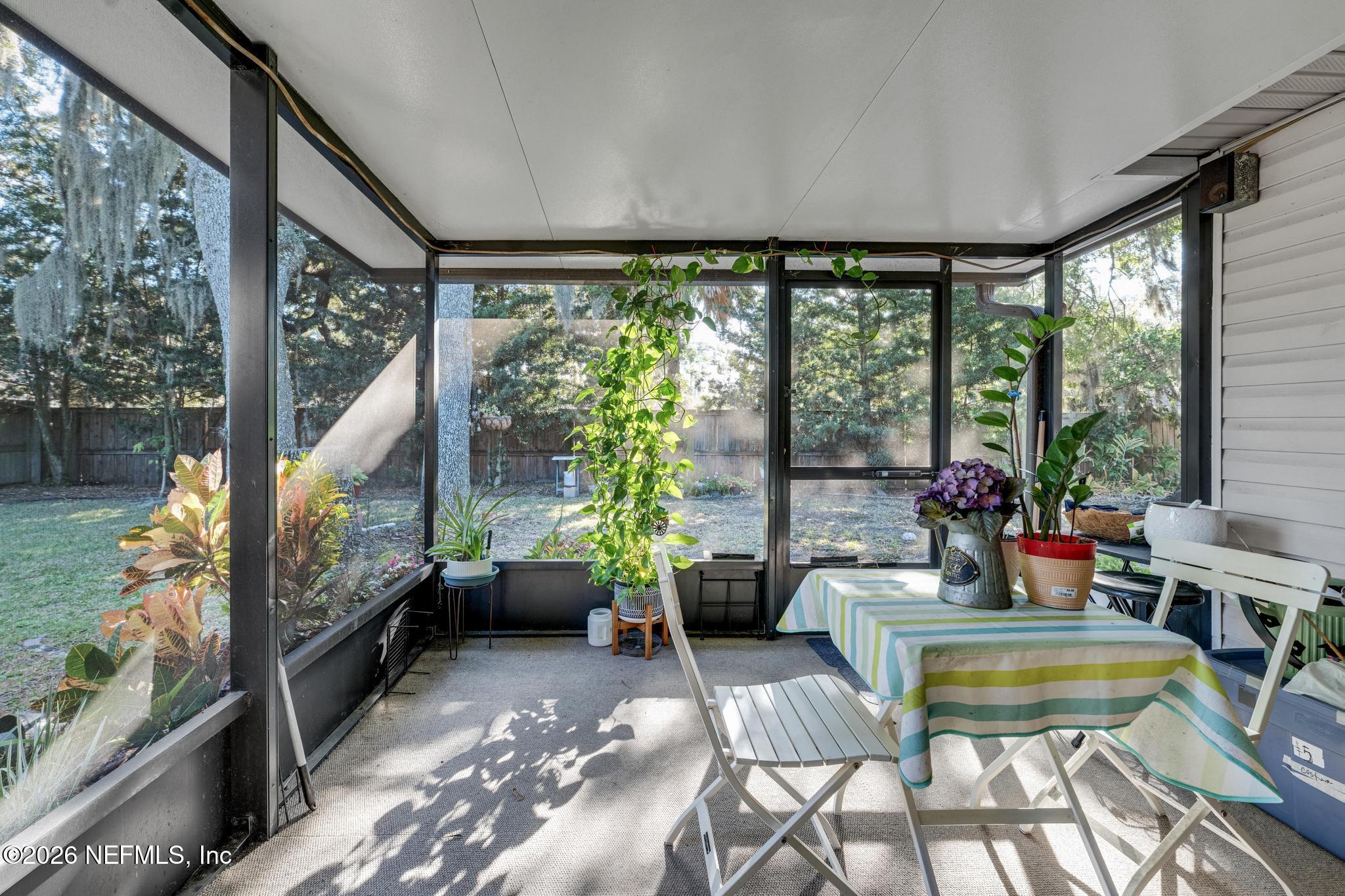 3566 Pond Ridge Court West Jacksonville, FL 32223 - Photo 12 of 13 a living room with furniture and a large window