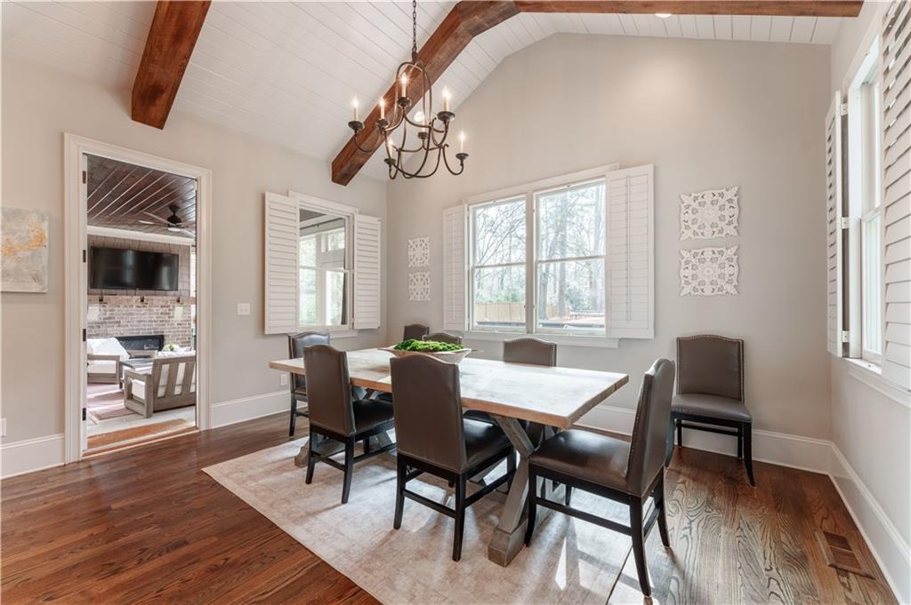 999 Ferncliff Road Northeast Atlanta, GA 30324 - Photo 17 of 52 a view of a dining room with furniture window and wooden floor
