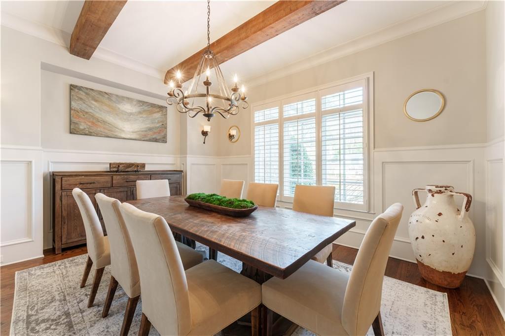 999 Ferncliff Road Northeast Atlanta, GA 30324 - Photo 20 of 52 a view of a dining room with furniture large window and wooden floor