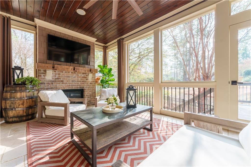 999 Ferncliff Road Northeast Atlanta, GA 30324 - Photo 21 of 52 a living room with fireplace furniture and a flat screen tv