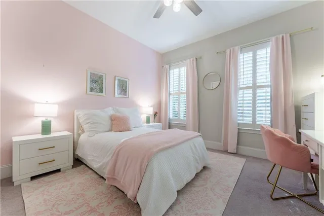 a bedroom with a bed and a chair