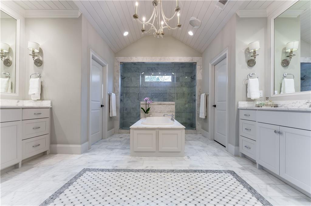 999 Ferncliff Road Northeast Atlanta, GA 30324 - Photo 32 of 52 a spacious bathroom with a double vanity sink a mirror and a shower