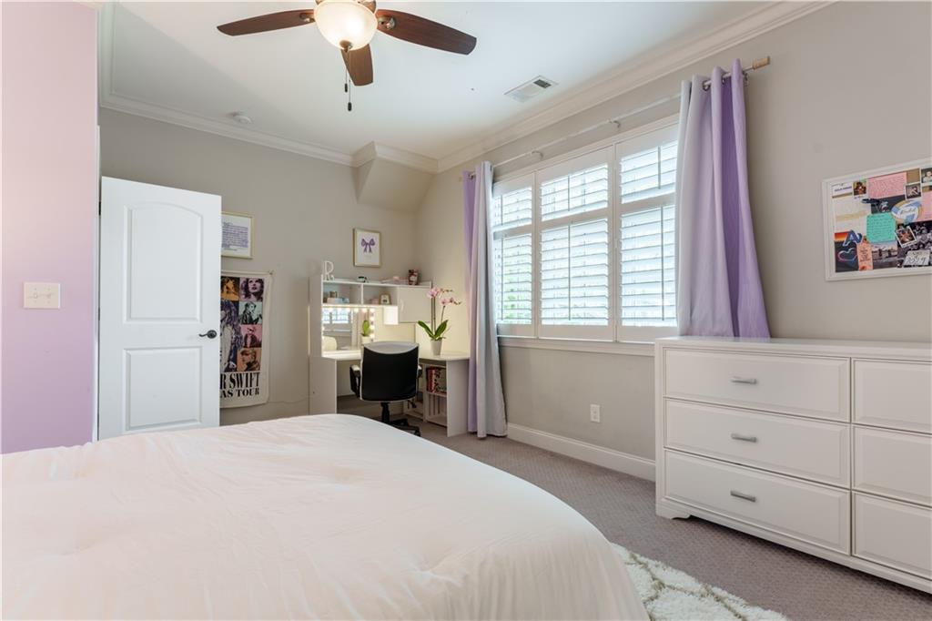 999 Ferncliff Road Northeast Atlanta, GA 30324 - Photo 34 of 52 a bedroom with a bed and a window