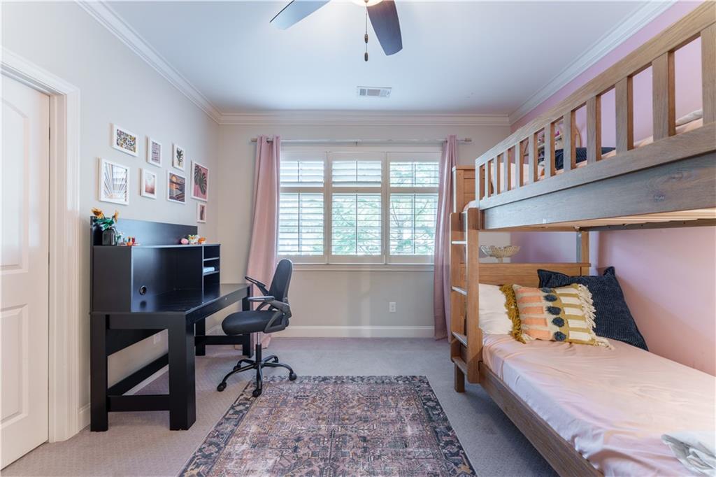999 Ferncliff Road Northeast Atlanta, GA 30324 - Photo 36 of 52 a bedroom with furniture and a window