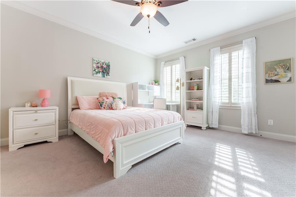 999 Ferncliff Road Northeast Atlanta, GA 30324 - Photo 38 of 52 a spacious bedroom with a bed and a window
