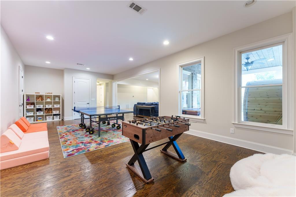 999 Ferncliff Road Northeast Atlanta, GA 30324 - Photo 39 of 52 a living room with furniture and wooden floor