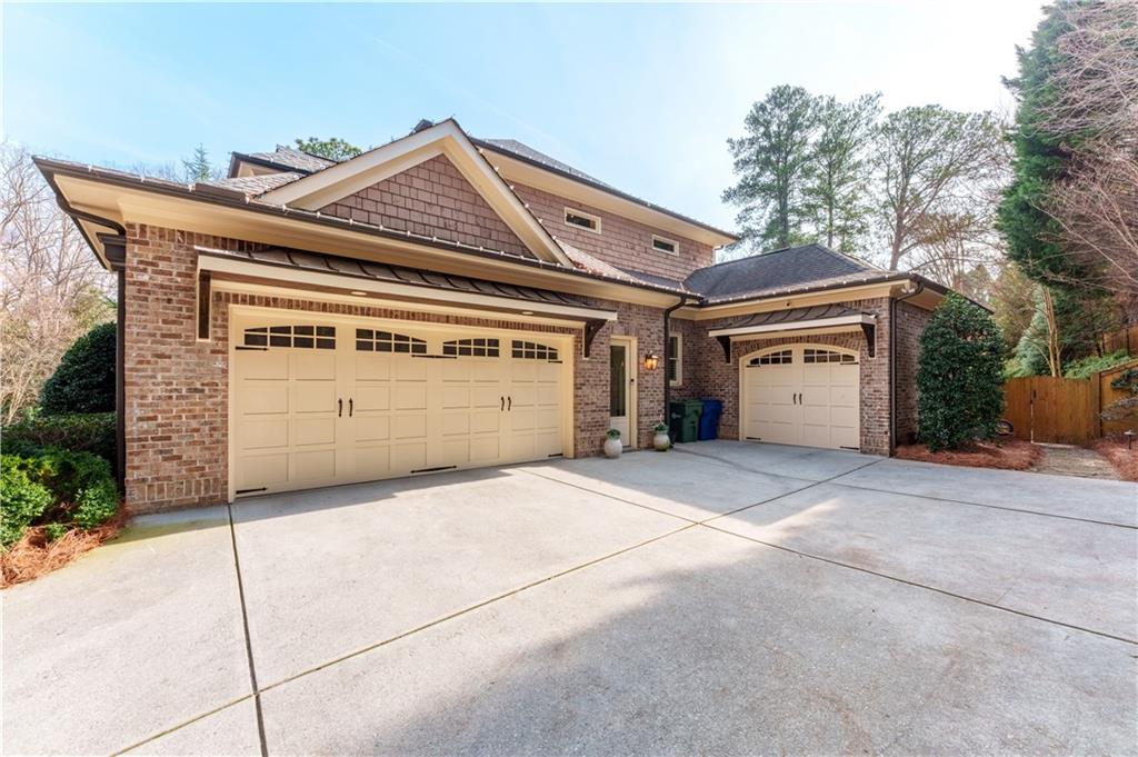 999 Ferncliff Road Northeast Atlanta, GA 30324 - Photo 48 of 52 a view of house with outdoor space and parking space
