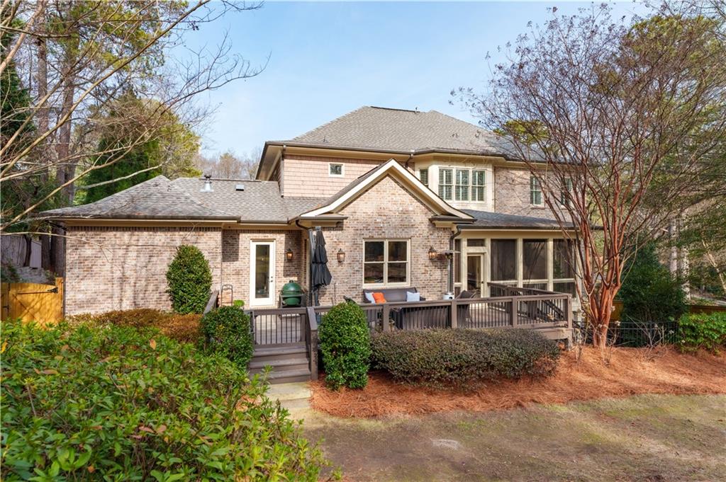 999 Ferncliff Road Northeast Atlanta, GA 30324 - Photo 5 of 52 a front view of a house with garden
