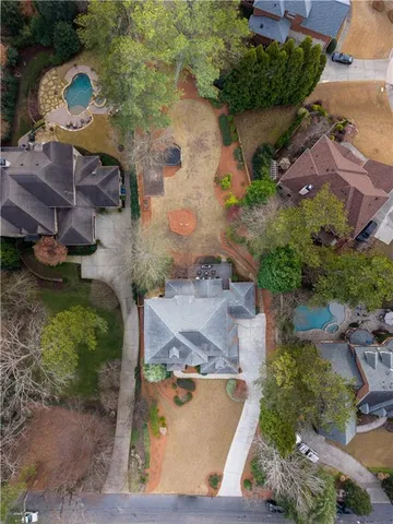 an aerial view of a house with outdoor space