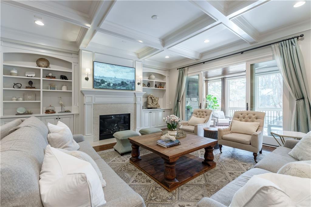 999 Ferncliff Road Northeast Atlanta, GA 30324 - Photo 9 of 52 a living room with furniture fireplace and a large window