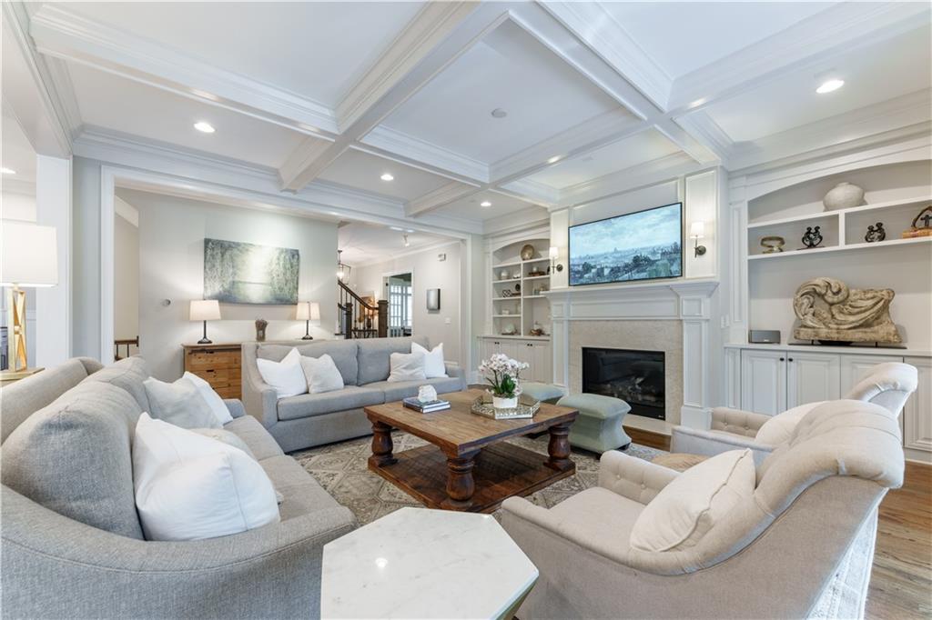 999 Ferncliff Road Northeast Atlanta, GA 30324 - Photo 10 of 52 a living room with furniture and a fireplace