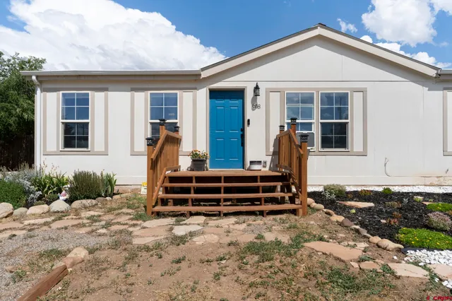 front view of a house with a small yard