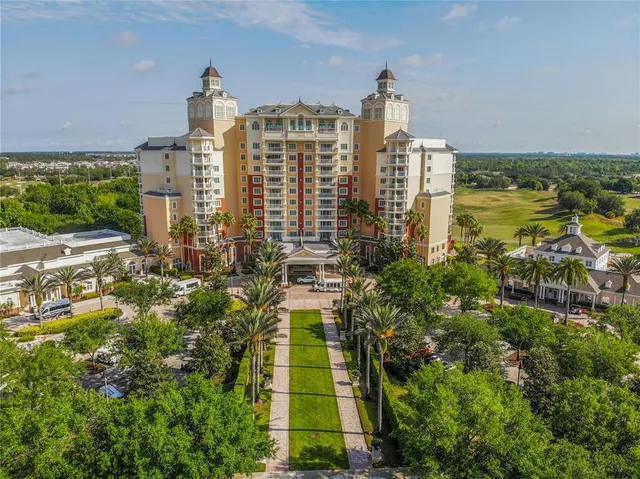 an aerial view of residential houses with outdoor space and swimming pool