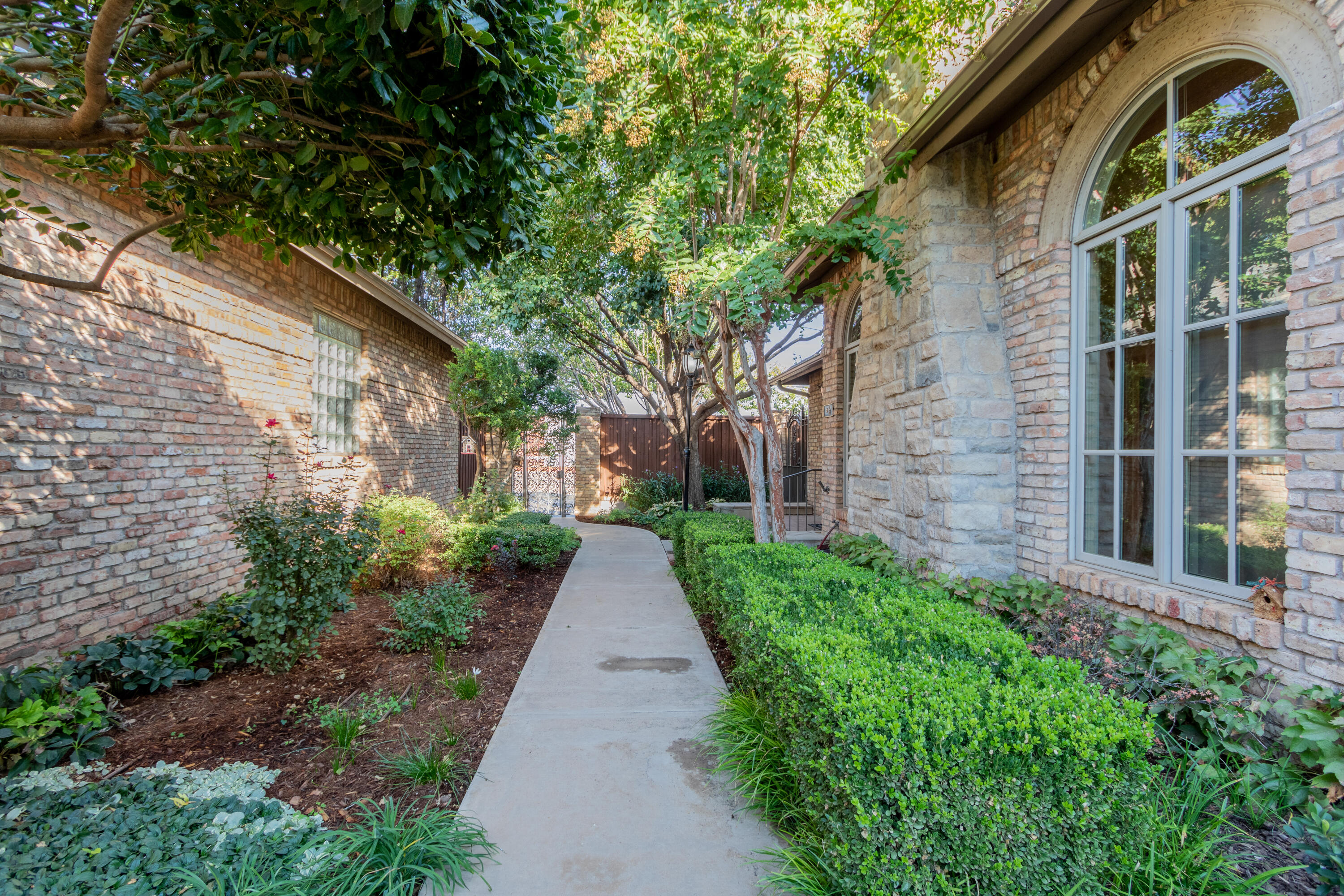 4501 19th Street, Unit 5 Lubbock, TX 79407 - Photo 2 of 52 a backyard of a house with lots of green space