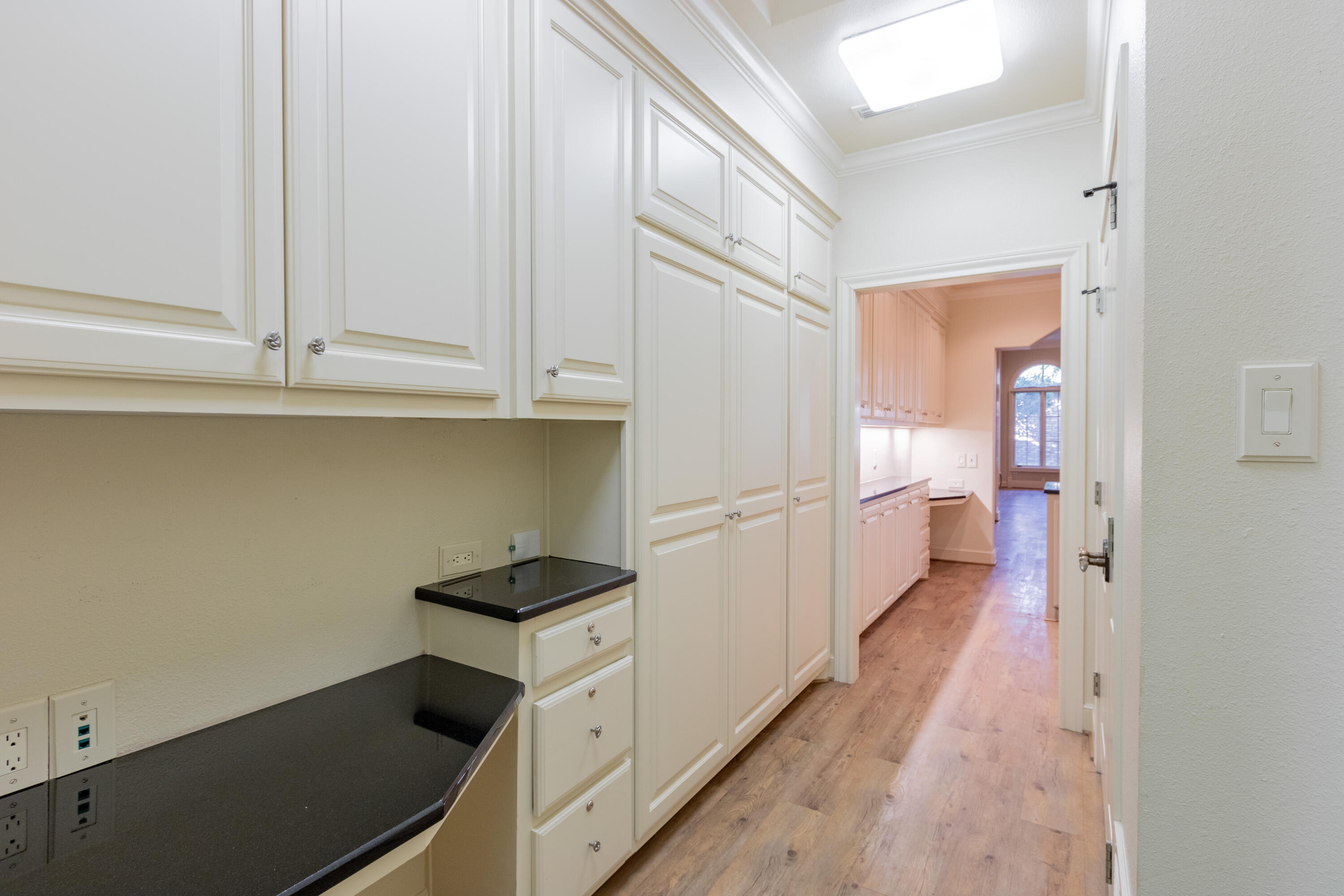 4501 19th Street, Unit 5 Lubbock, TX 79407 - Photo 28 of 52 a kitchen with granite countertop white cabinets and white appliances