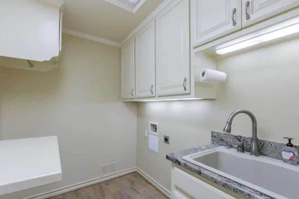 a room with a sink and a mirror