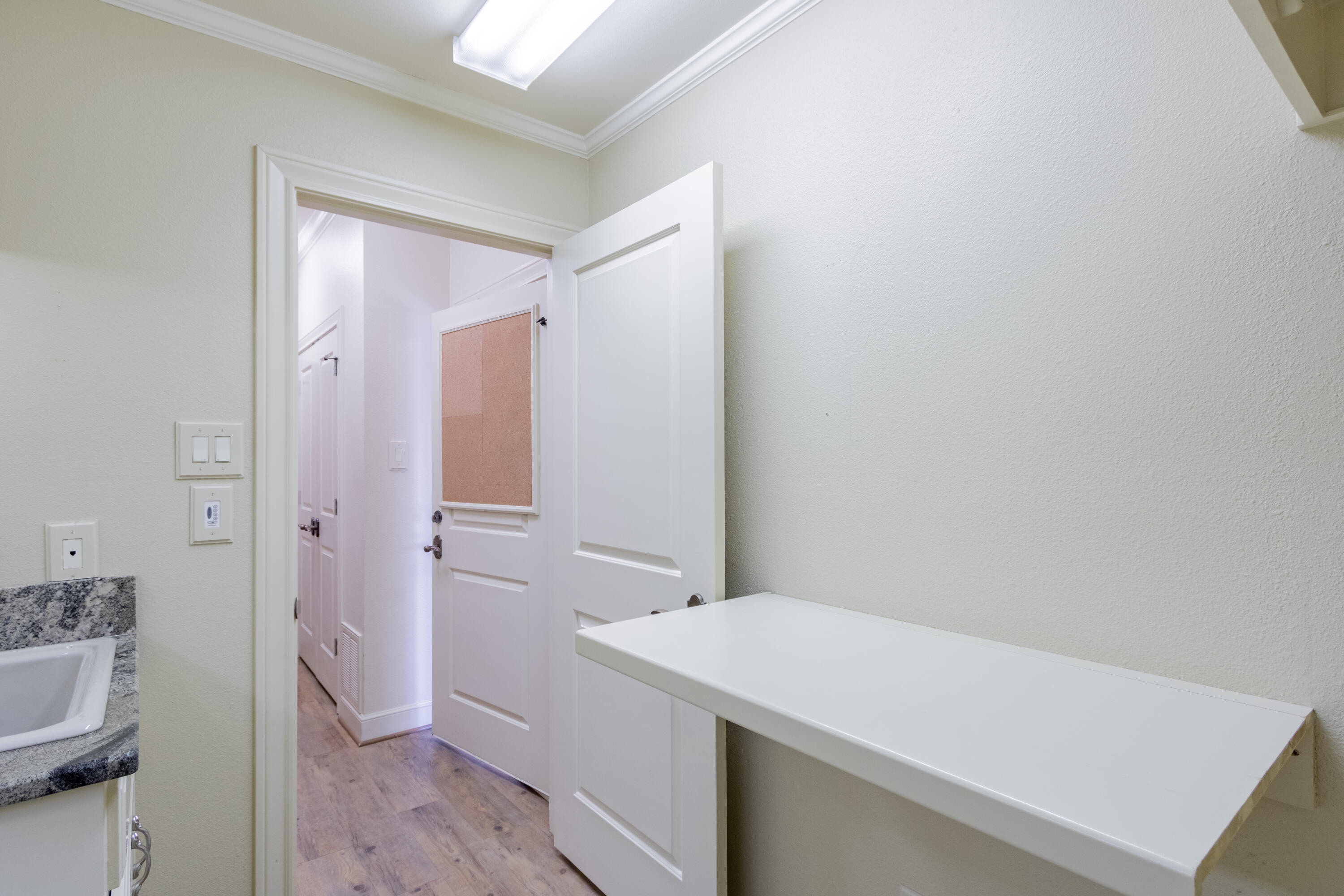 4501 19th Street, Unit 5 Lubbock, TX 79407 - Photo 30 of 52 a room with a sink and a mirror