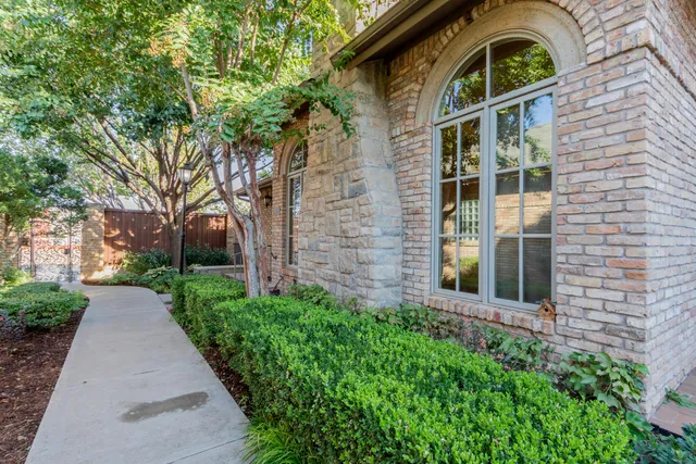 front view of a house with a garden