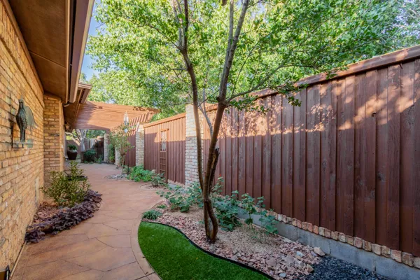 a backyard of a house with lots of green space