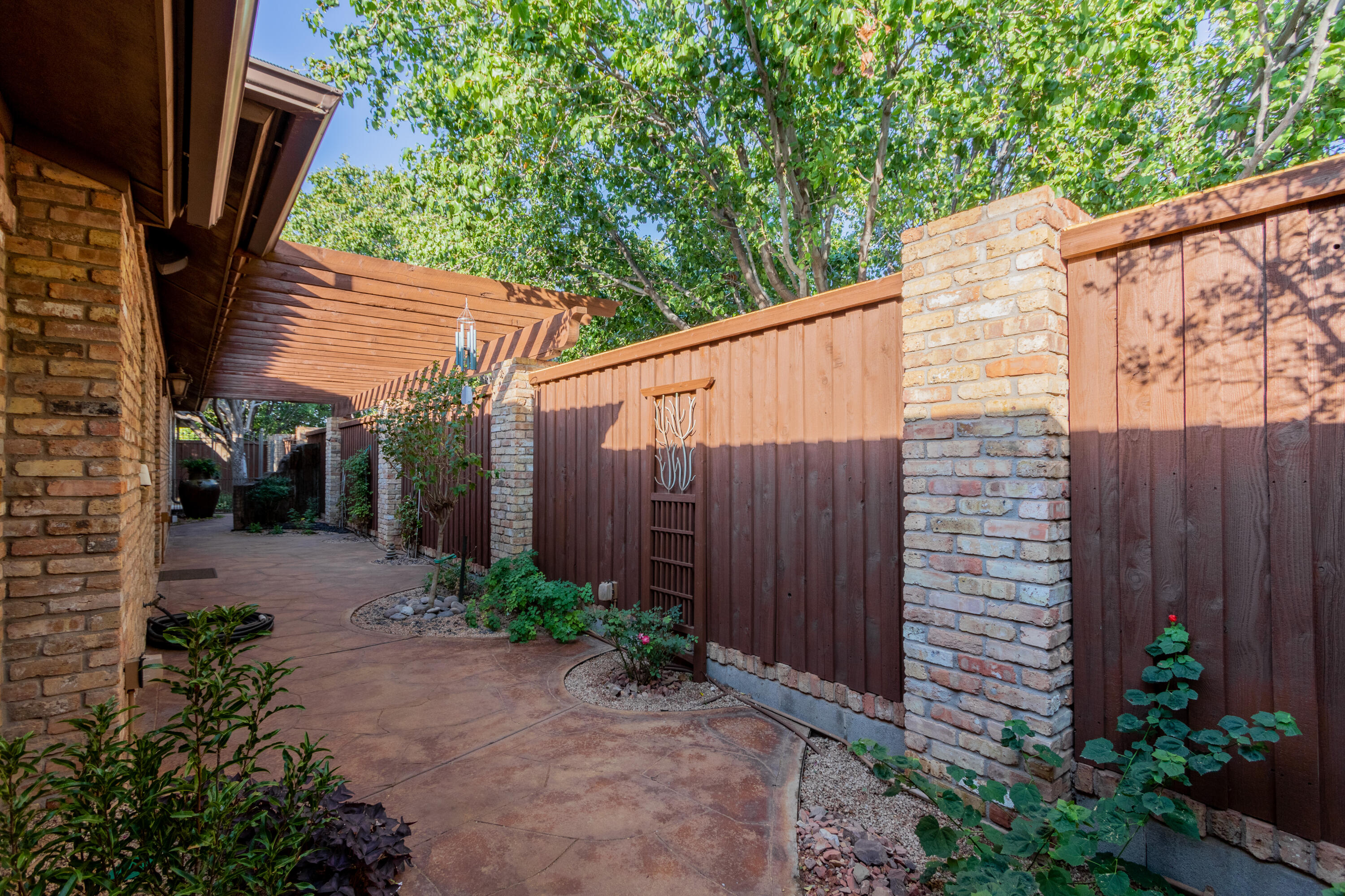 4501 19th Street, Unit 5 Lubbock, TX 79407 - Photo 43 of 52 a backyard of a house with lots of green space