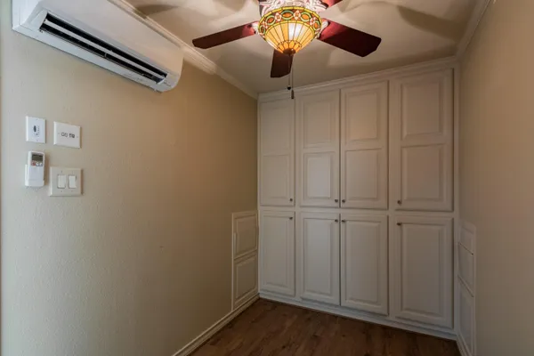 an empty room with wooden floor
