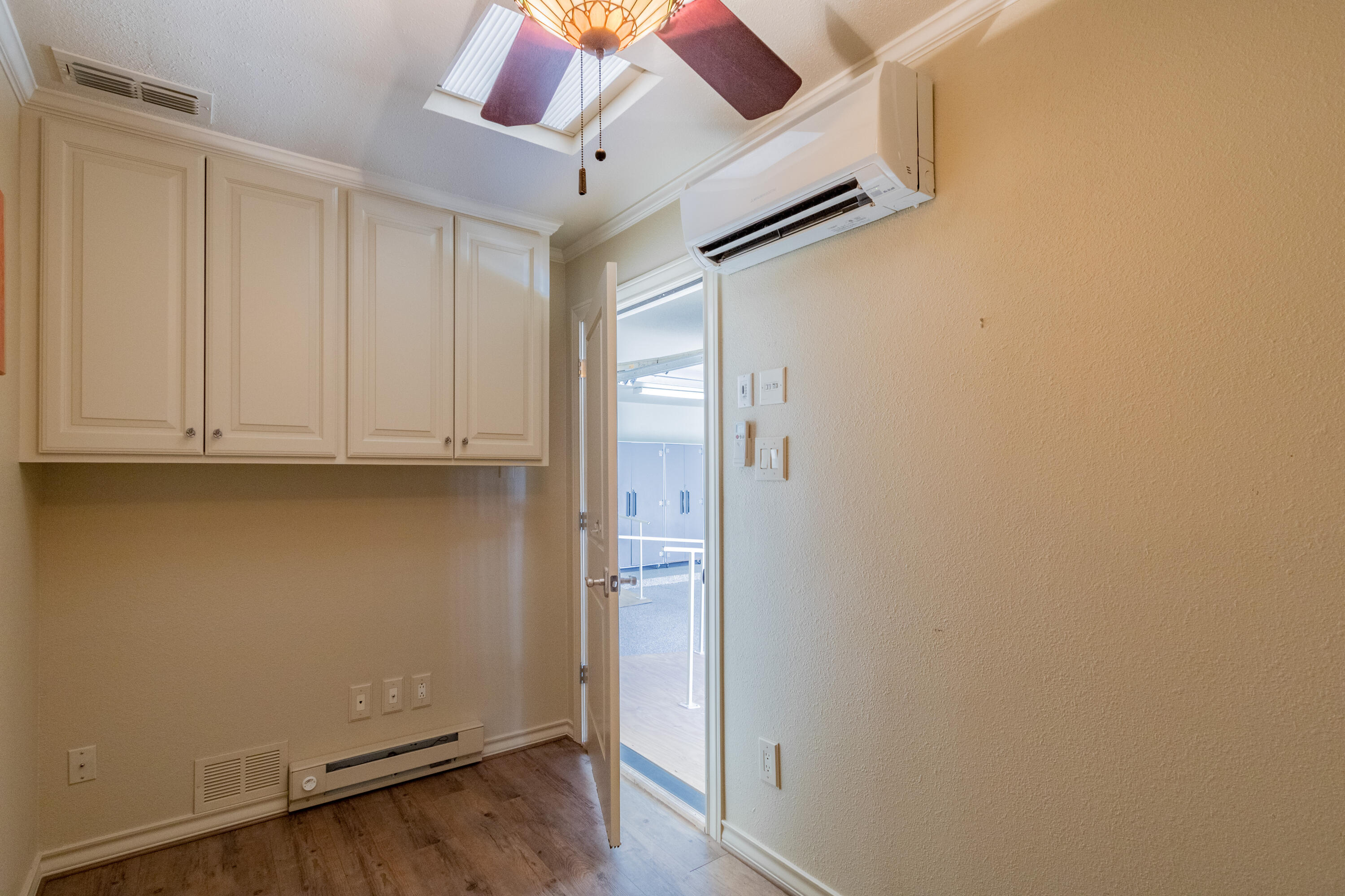 4501 19th Street, Unit 5 Lubbock, TX 79407 - Photo 46 of 52 an empty room with wooden floor