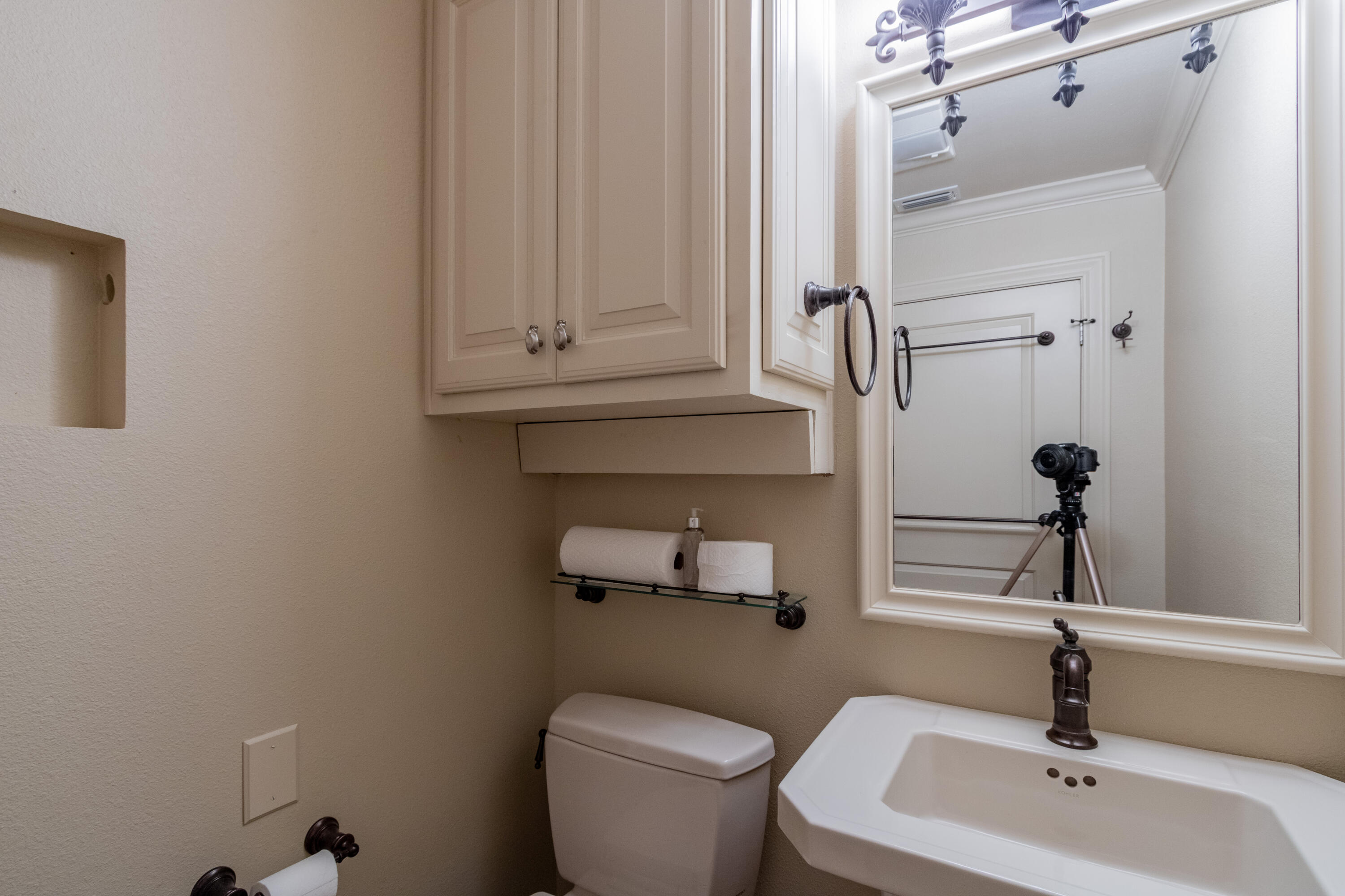 4501 19th Street, Unit 5 Lubbock, TX 79407 - Photo 47 of 52 a bathroom with a toilet a sink and mirror
