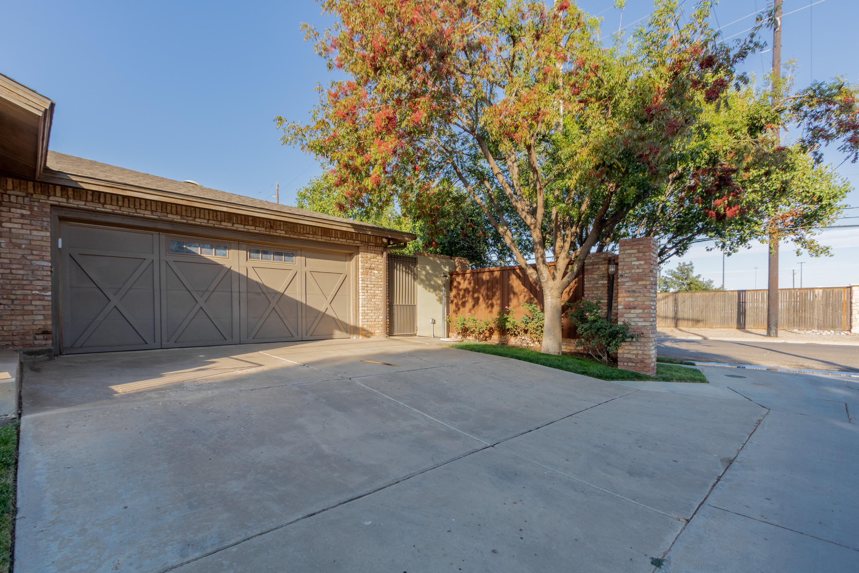 4501 19th Street, Unit 5 Lubbock, TX 79407 - Photo 51 of 52 a view of backyard and tree