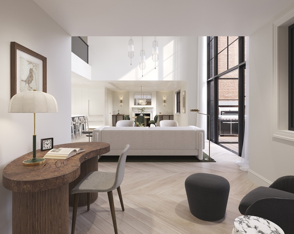 397 Commonwealth Avenue, Unit PH Boston, MA 02215 - Photo 3 of 8 a living room with furniture and a table