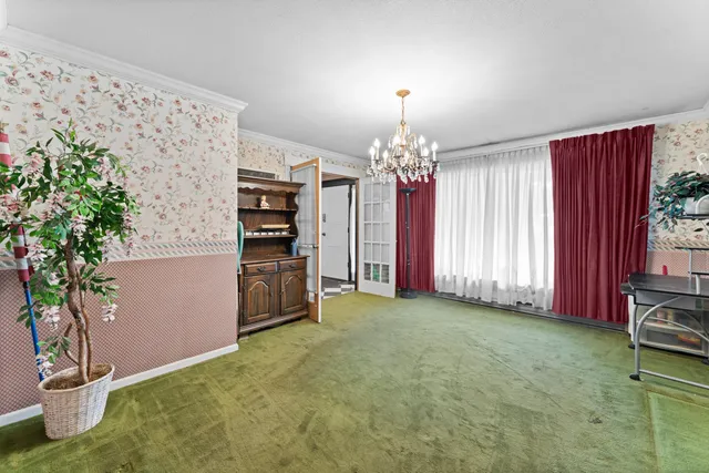 a view of a kitchen with furniture and chandelier