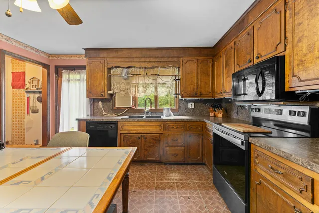 a bathroom with a sink toilet and mirror