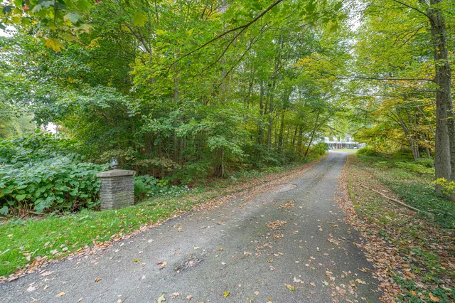 a view of a road with a building in the background
