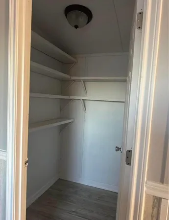 a view of a room with racks on the wall