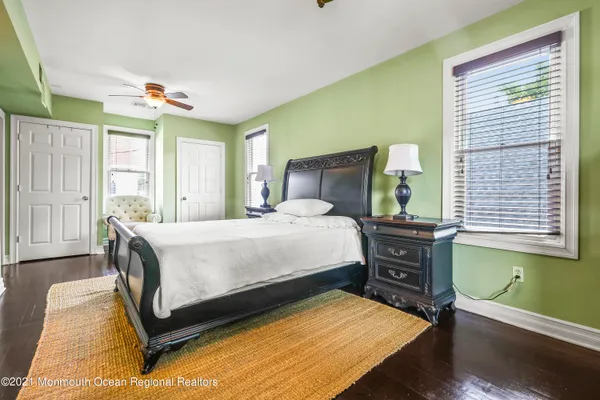 a living room with stainless steel appliances kitchen island granite countertop furniture a rug and a window