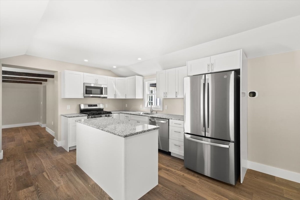 146 Miller Street Middleboro, MA 02346 - Photo 15 of 23 a kitchen with stainless steel appliances a refrigerator a stove a sink and white cabinets