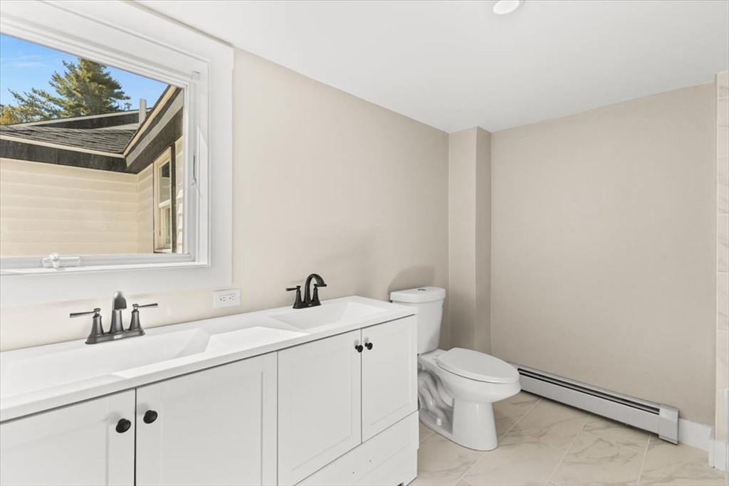 146 Miller Street Middleboro, MA 02346 - Photo 21 of 23 a bathroom with a toilet a sink and mirror