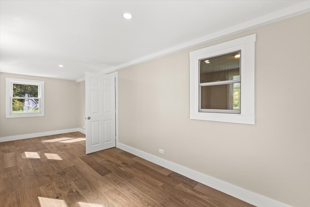146 Miller Street Middleboro, MA 02346 - Photo 8 of 23 an empty room with wooden floor and windows
