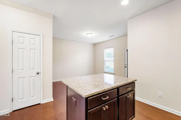 a kitchen with stainless steel appliances and granite countertop