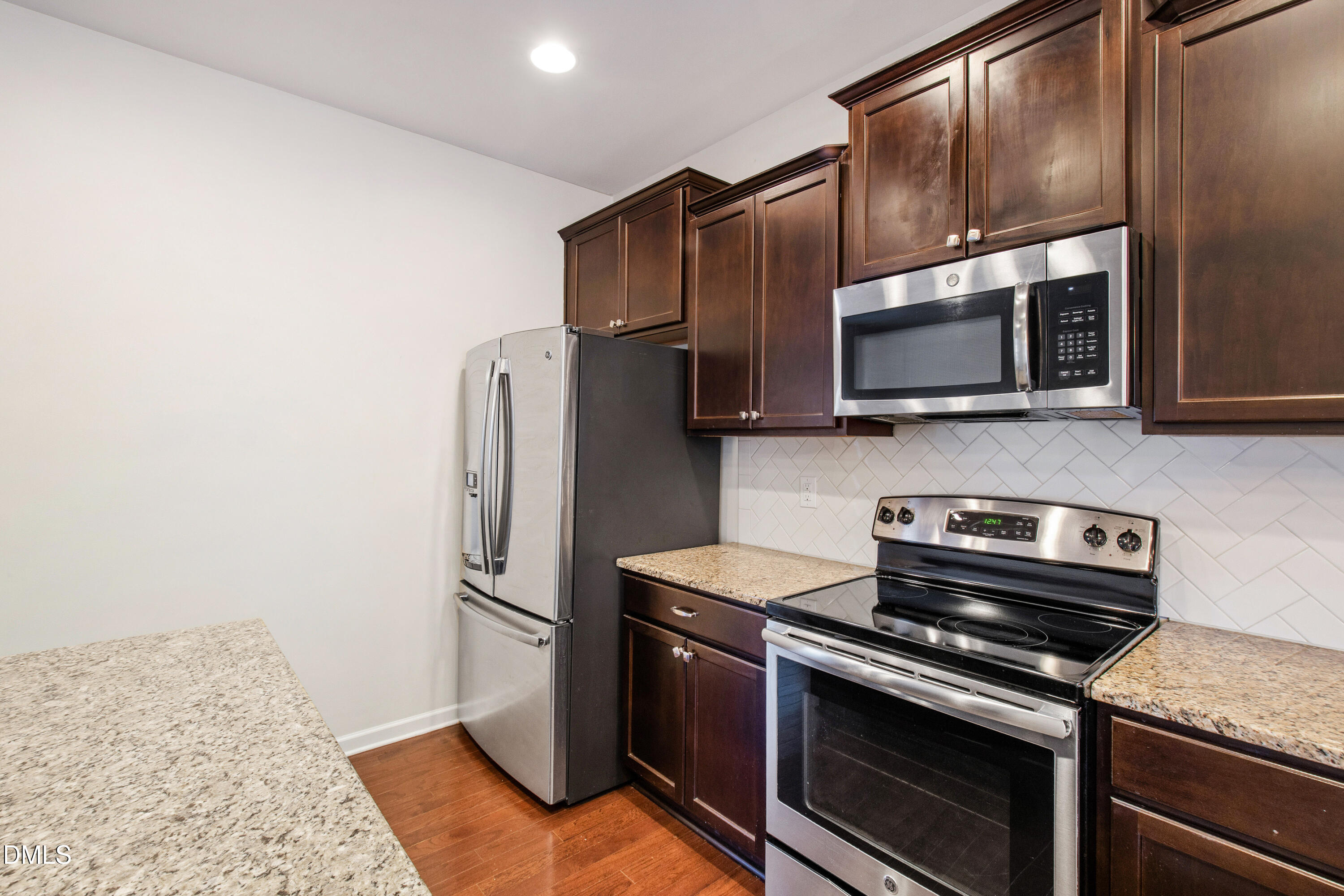1118 Renewal Place Raleigh, NC 27603 - Photo 14 of 38 a kitchen with stainless steel appliances and granite countertop