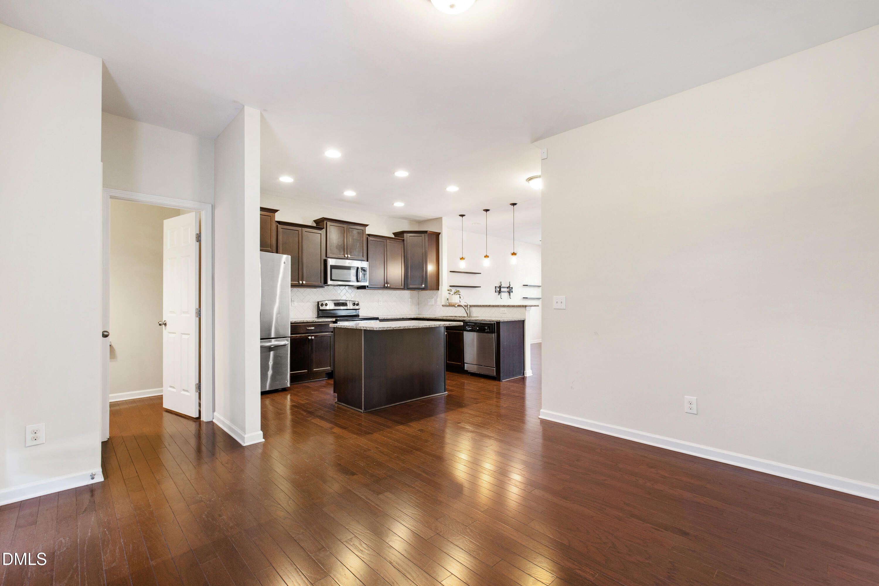 1118 Renewal Place Raleigh, NC 27603 - Photo 16 of 38 a kitchen with a sink cabinets and wooden floor