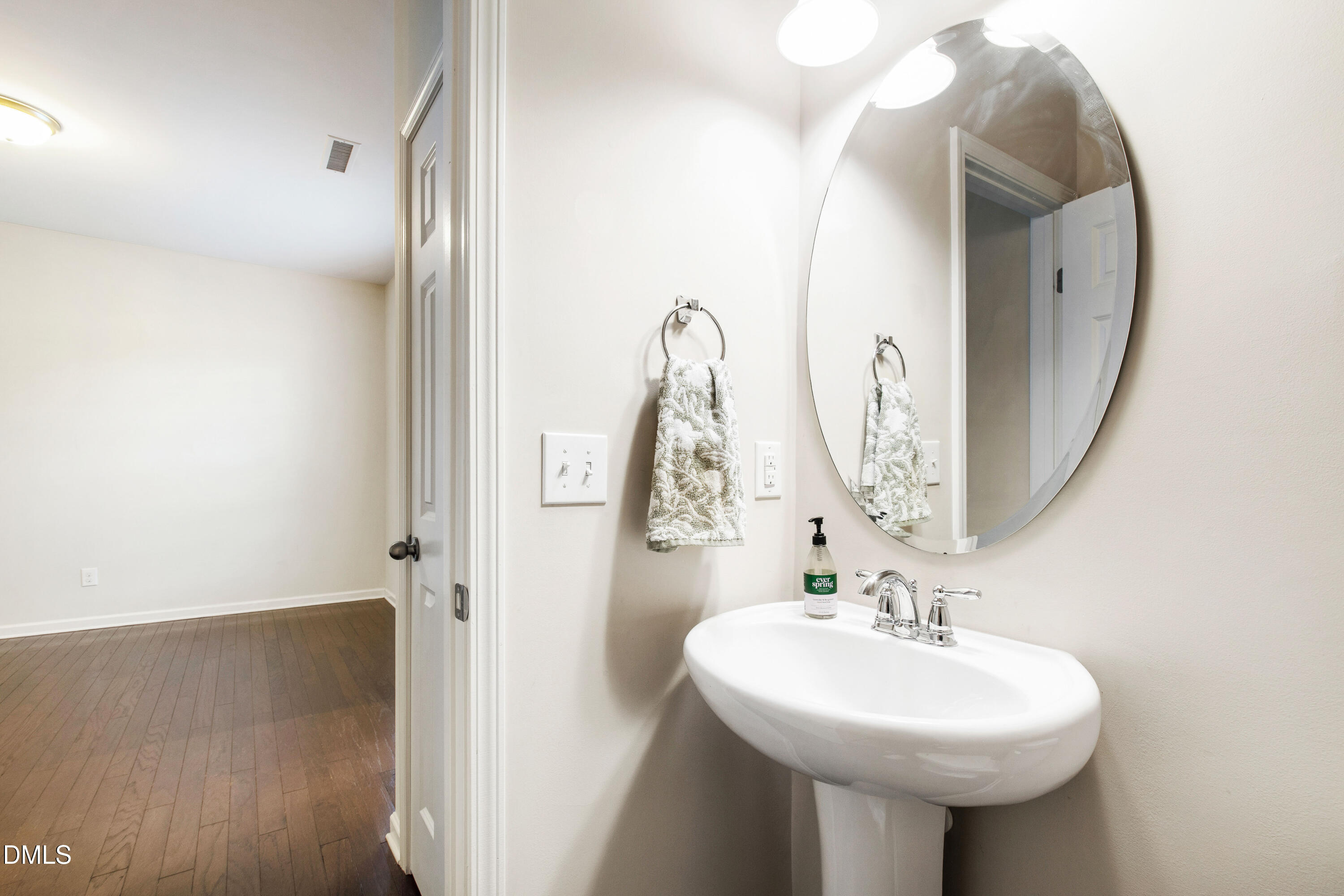 1118 Renewal Place Raleigh, NC 27603 - Photo 18 of 38 a bathroom with a sink and a mirror