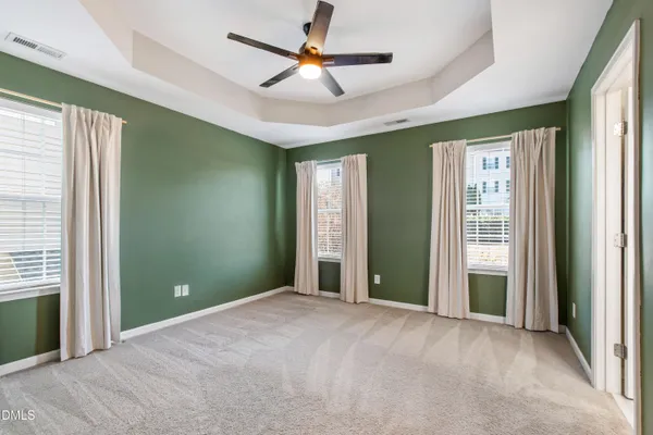 a view of a livingroom with a chandelier fan