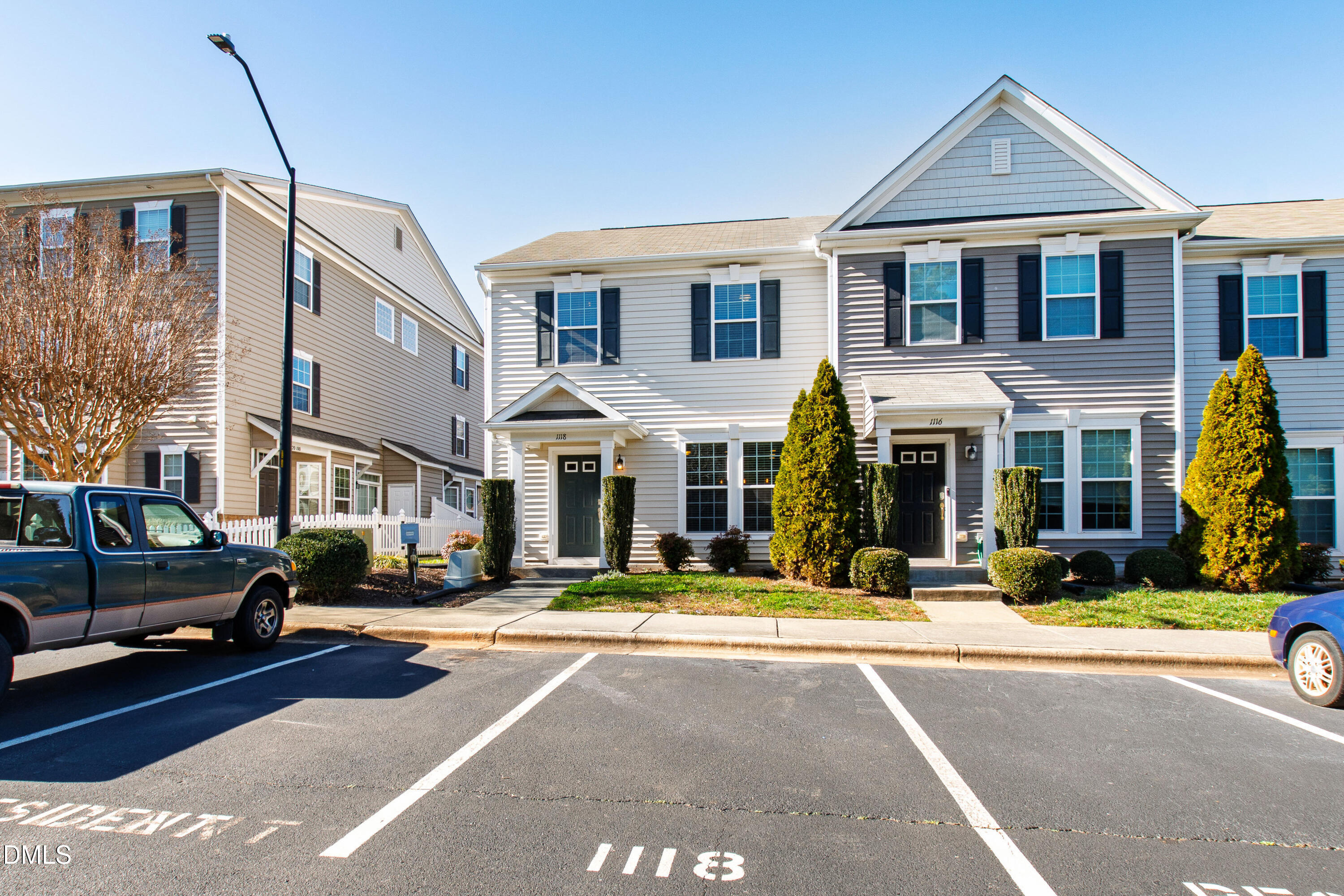 1118 Renewal Place Raleigh, NC 27603 - Photo 2 of 38 a front view of a building with cars parked